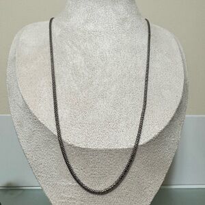 Noir Diamond cut silver necklace stamped 925.  Adjustable chain 20 inches